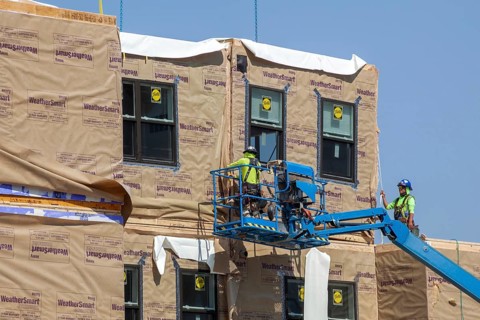 Detroit, Michigan - Workers use modular construction methods to build apartments for low to