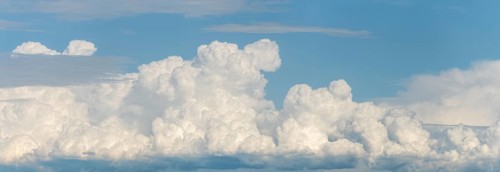 A large cloud in the sky. The sky is blue. The cloud is white.Bas rhin, Alsace, grand est, France