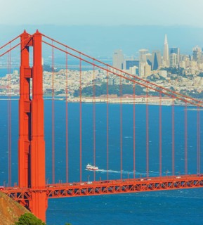 View of Golden Gate Bridge and financial district in the distance, San Francisco, California, USA