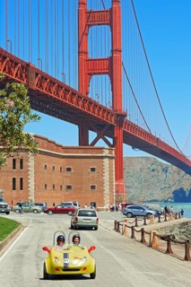 People driving vintage car, San Francisco, California, USA
