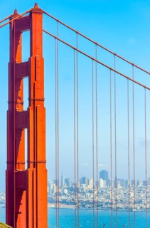 View of Golden Gate Bridge and financial district in the distance, San Francisco, California, USA