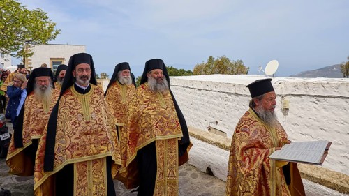 Priests in golden robes read from a Bible during a procession, Orthodox ceremony, monks of St