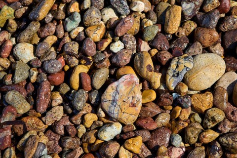 Various colourful pebbles with a smooth surface lying close together, Lambi Beach, Lambi Bay,
