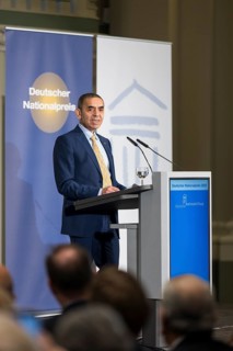 Ugur Sahin (founder of Biontech SE) gives an acceptance speech after receiving the German National