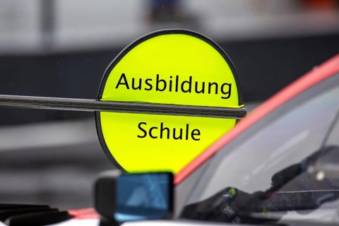 (Photomontage) Training Symbol image: Lollipop in motorsport with modified text Training / School
