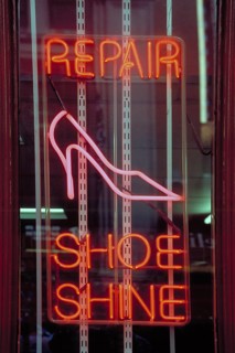 Illuminated advertising Shoe Repair in a shop, New York City, USA