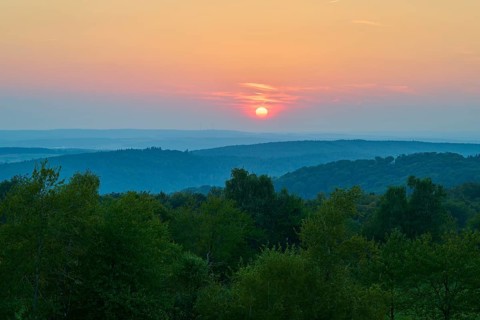 Pink sunset over wooded hills, quiet evening atmosphere, Geishöhe, Dammbach, Spessart, Bavaria,