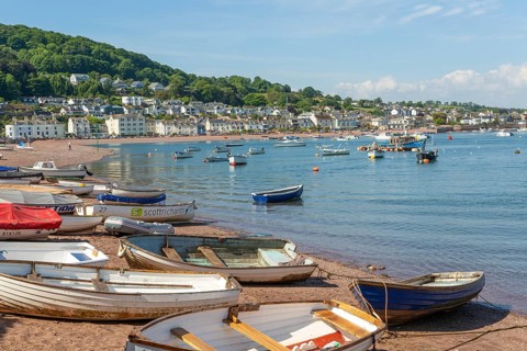 Small boats in harbour at Back Beach, Teignmouth, south Devon, England, UK view to Shaldon