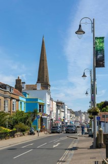 Shops in street of historic buildings, The Strand, Dawlish, south Devon, England, UK