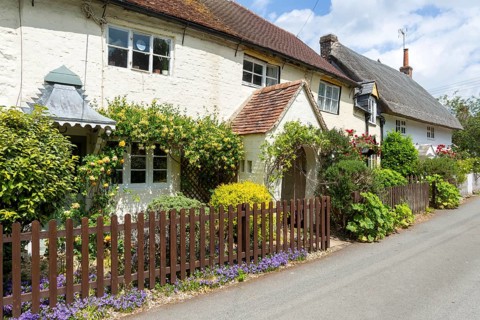 Attractive historic cottages in village of Avebury, Wiltshire, England, UK