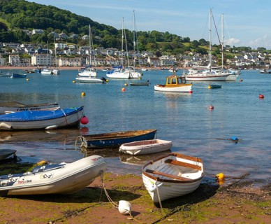 Small boats in harbour at Back Beach, Teignmouth, south Devon, England, UK view to Shaldon