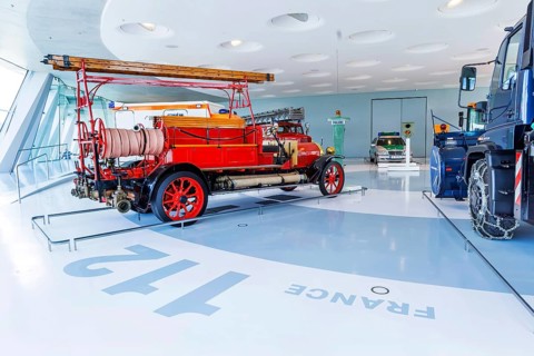 Gallery of helpers with rescue and police vehicles. The Mercedes-Benz Museum in Stuttgart presents