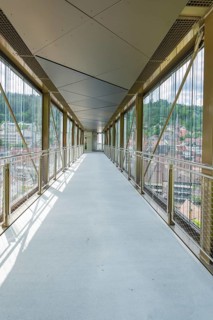 Interior view of a modern bridge with glass walls and panoramic views of the surrounding area, Zob