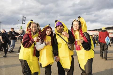 Festival visitors from Ukraine are at Rock am Ring for the 4th time and pose in banana costumes at