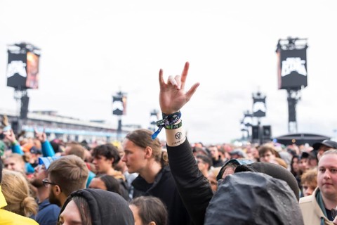 A festival visitor shows the French fries fork at the Rock am Ring Festival on Friday, Nürburgring