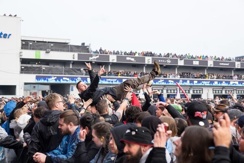 Festival visitors crowdsurfing at the Rock am Ring Festival on Friday, Nürburgring race track race