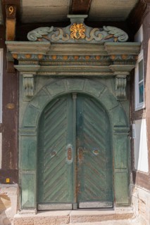 The Bürgersche Haus from 1639, entrance portal, with motto, coat of arms and ornamentation, Bad
