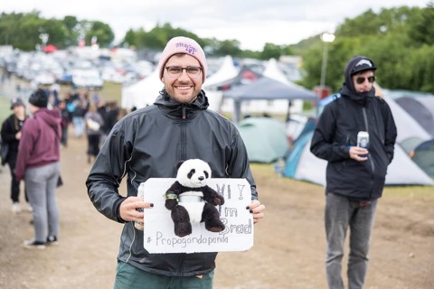 Festival visitor with panda (#Propagandapanda) on a campsite at the Rock am Ring Festival on
