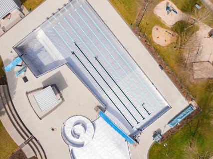 Aerial view of an empty swimming pool with clearly marked swimming lanes, renewal of the swimming