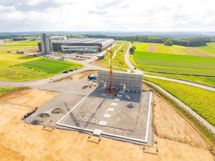 Extensive construction site in a rural area with construction vehicles and crane, ING Park