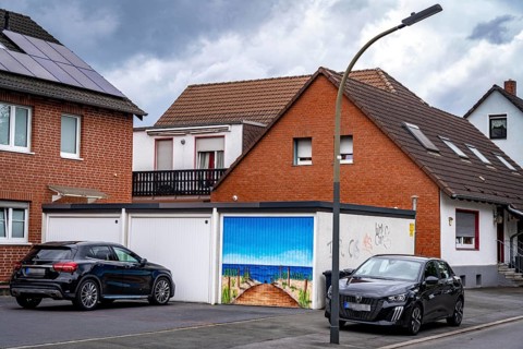 Residential neighbourhood, residential street in Dortmund-Marten, multi-family houses, garages, one