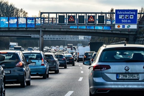 Driving on the A40 motorway, Ruhrschnellweg, in heavy traffic, drivers' perspective, Bochum, North