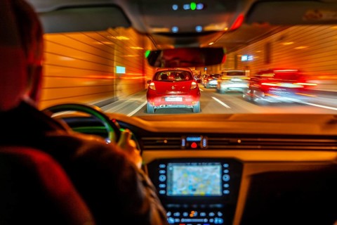 Driving on the A40 motorway, Ruhrschnellweg, in heavy traffic, driver's perspective, tunnel, Essen,