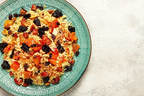 Rice dish, with the addition of dried fruits, nuts and spices of Middle Eastern cuisine, homemade,
