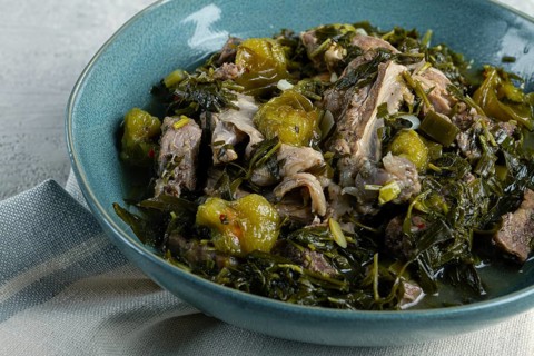 Chakapuli, Georgian dish, stewed meat with herbs and tkemali, in white wine, homemade, no people
