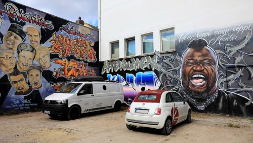 Murals of the local graffiti scene. The portrait of Keno Veith is particularly distinctive, with