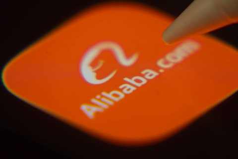 Dhaka, Bangladesh- 06 Dec 2025: Close-up of the Alibaba app on a screen with a stylus pointing at