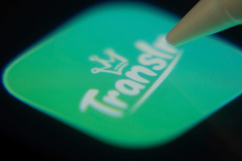 Dhaka, Bangladesh- 06 Dec 2025: Close-up of the Translr app on a screen with a stylus pointing at