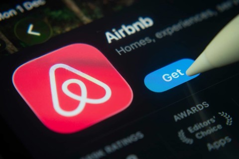 Dhaka, Bangladesh- 01 Dec 2025: A close-up of the Airbnb app icon in the App Store on an iPad
