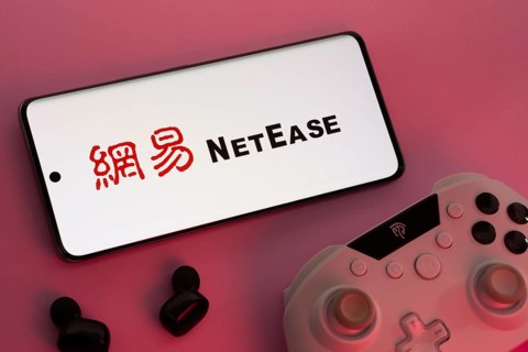 Dhaka, Bangladesh- 08 Apr 2025: A smartphone displaying the NetEase logo next to a gaming