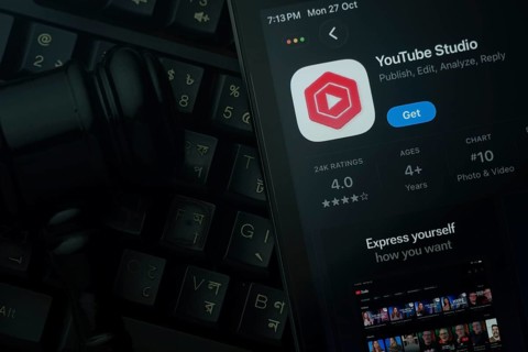Dhaka, Bangladesh- 28 Oct 2025: An iPad displaying the Youtube Studio app against a judge's gavel