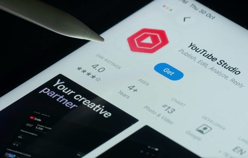 Dhaka, Bangladesh- 30 Oct 2025: Youtube Studio app on a iPad screen with a pen pointing at the