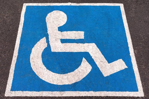 Parking space marked in blue for disabled people, Romania