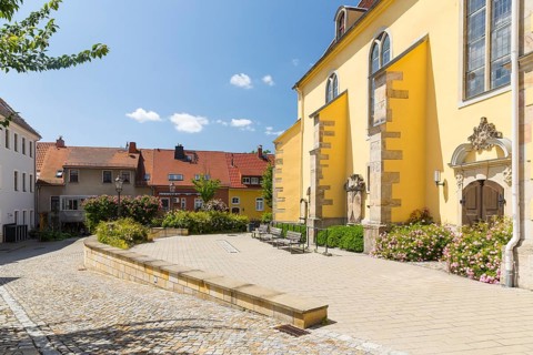 Church square with the town church of St. Nicolai in Pulsnitz, Saxony, Germany