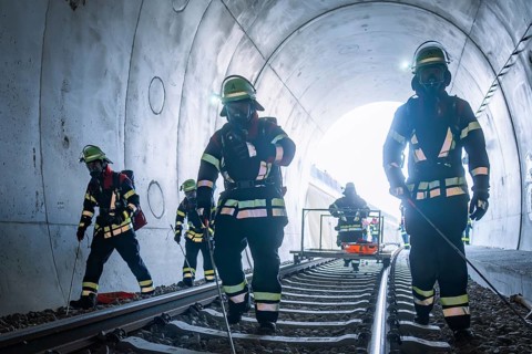 Firefighters in a tunnel working on rails, fire brigade exercise on the Hermann Hesse Railway,