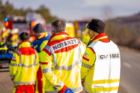 Rescue workers and firefighters discuss during an emergency operation, fire brigade exercise on the