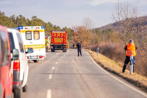 Street scene with emergency vehicles and personnel in a wintry landscape, fire brigade exercise on
