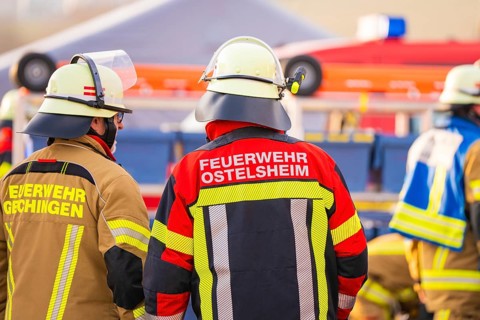Several firefighters in protective clothing on duty, fire brigade exercise on the Hermann Hesse