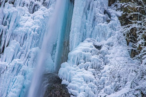 Urach waterfall full of bizarre ice formations frozen at winter temperatures, Bad Urach, Swabian