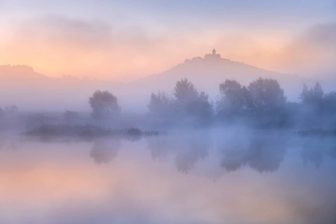 Landscape with lake at dawn at sunrise, fog rising, Wachsenburg fortress reflected in still water,