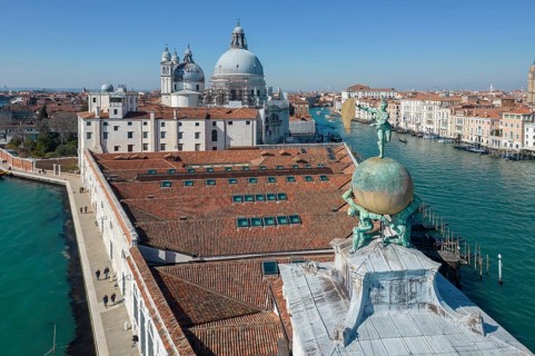 Drone footage of the Dogana da Mar, moving wind vane of Saint Fortuna on a gilded globe carried by