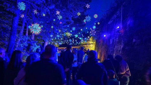 Night atmosphere with magical blue lights and people at a party, Kronach glows, Frankenwald nature