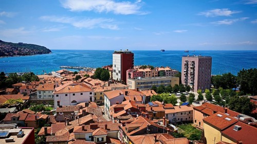 Panorama of a coastal town with red roofs and sea horizon, Koper, Slovenia