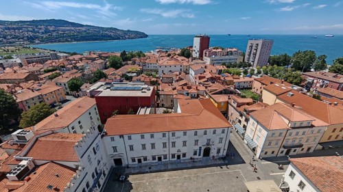 View of a coastal town with red roofs and the sea in the background, Izola, Slovenia