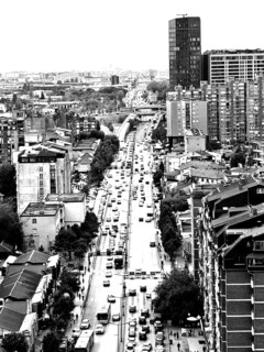 City view of a busy street with skyscrapers in the background in black and white, Pristina, Kosovo