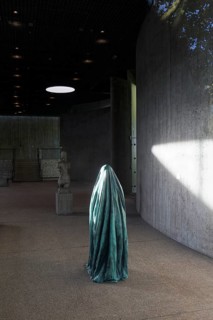 Statue of a veiled figure in the Lehmbruck Museum, looking through window, self-portrait as a ghost
